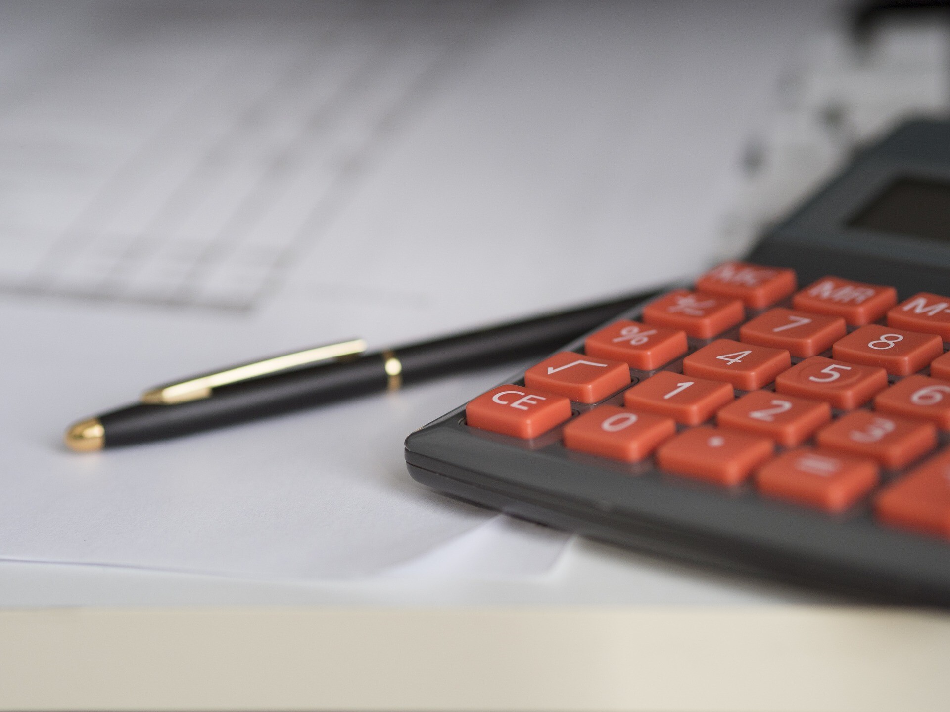 Pen, Calculator and Paperwork